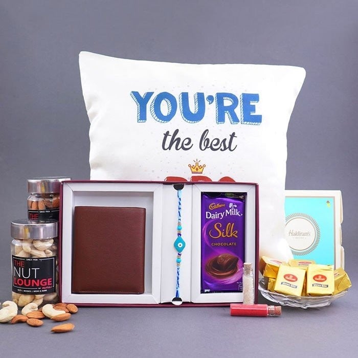 Evil Eye Rakhi With Cushion Gift Hamper